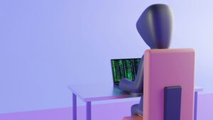 PCを操作するハッカーの後ろ姿
